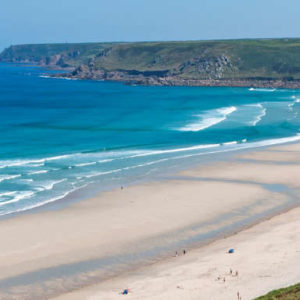 Sennen Beach surfing - view of the beach with waves coming in