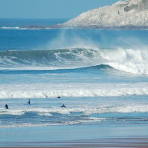 Woolacombe beach surfing - Surfers riding waves at Woolacombe Beach