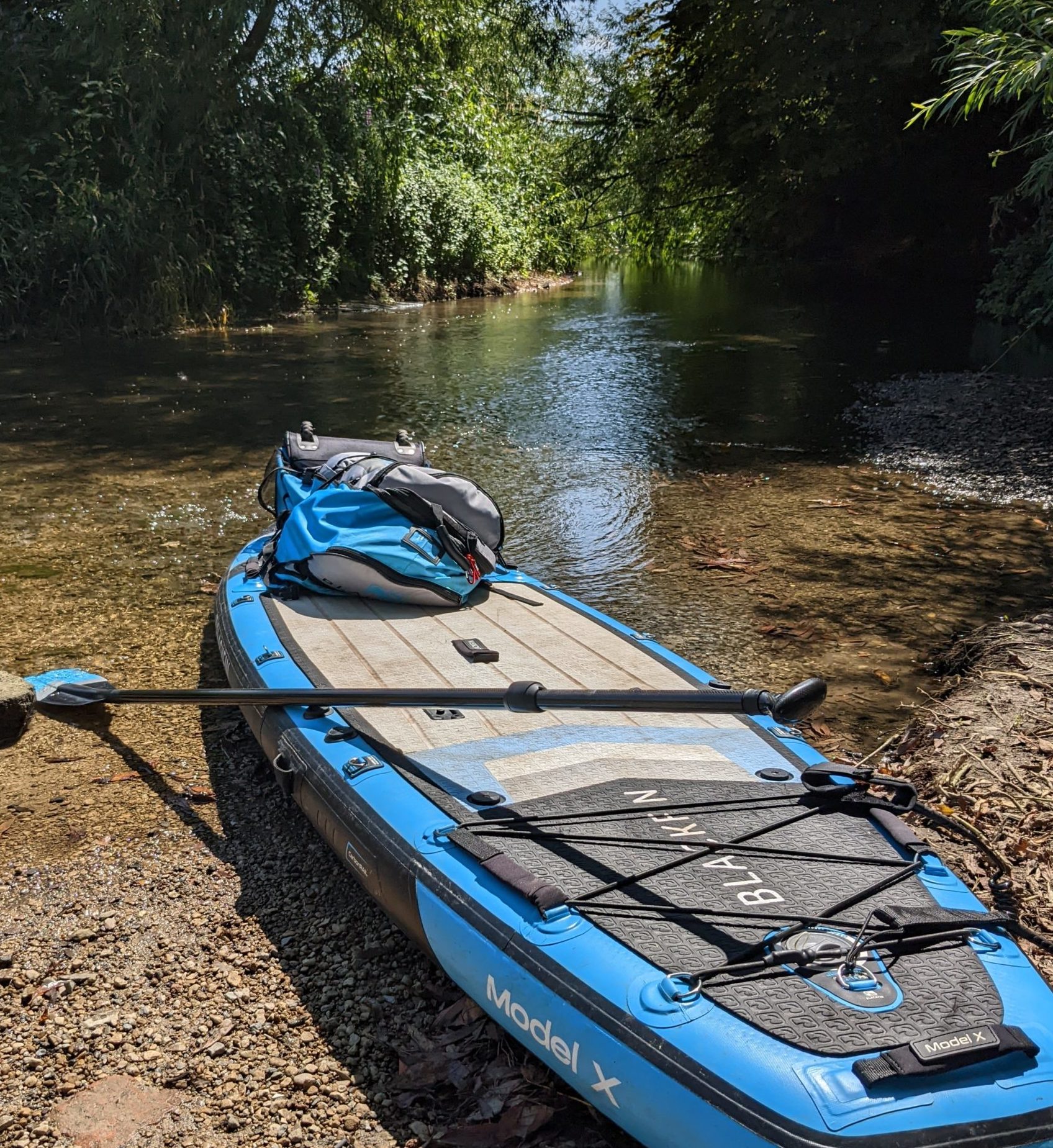Paddle board in the water at the start of the river thames in cricklade