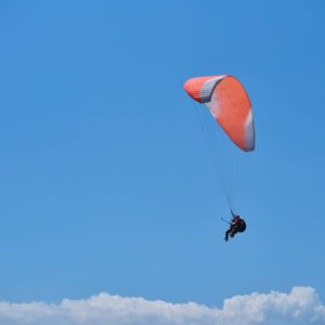 Paraglider in the sky with clouds over brecon beacons wales