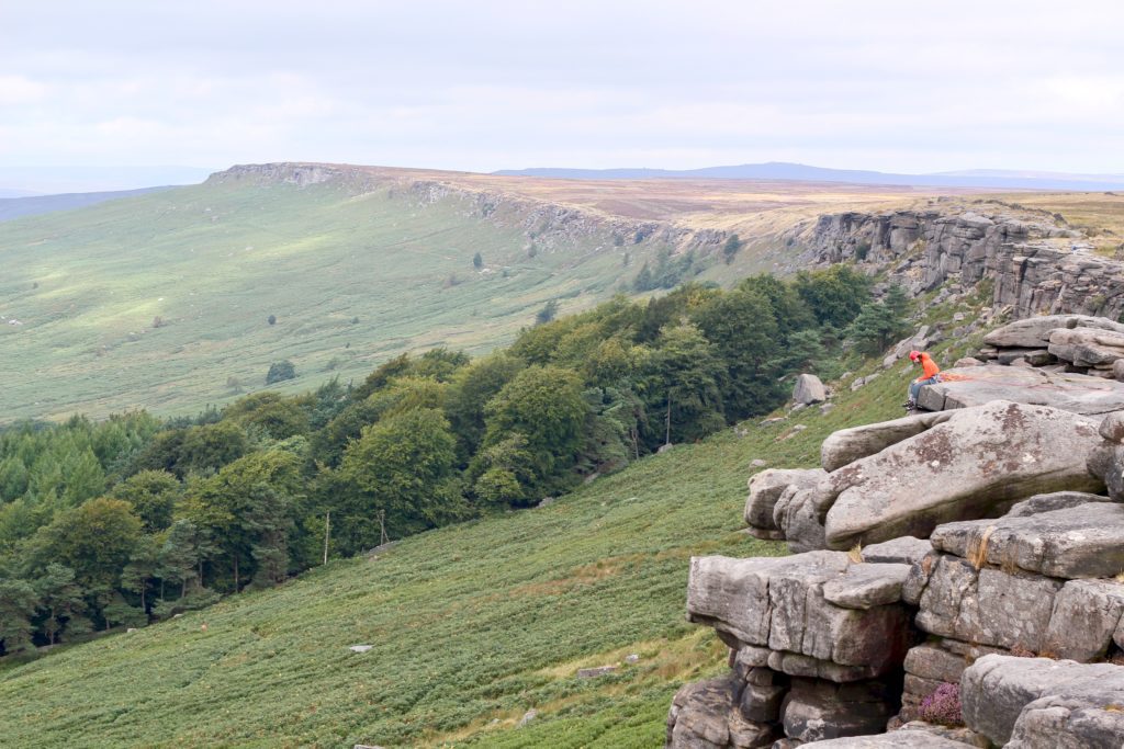 Outdoor activities in the peak district at stanage rocks, uk