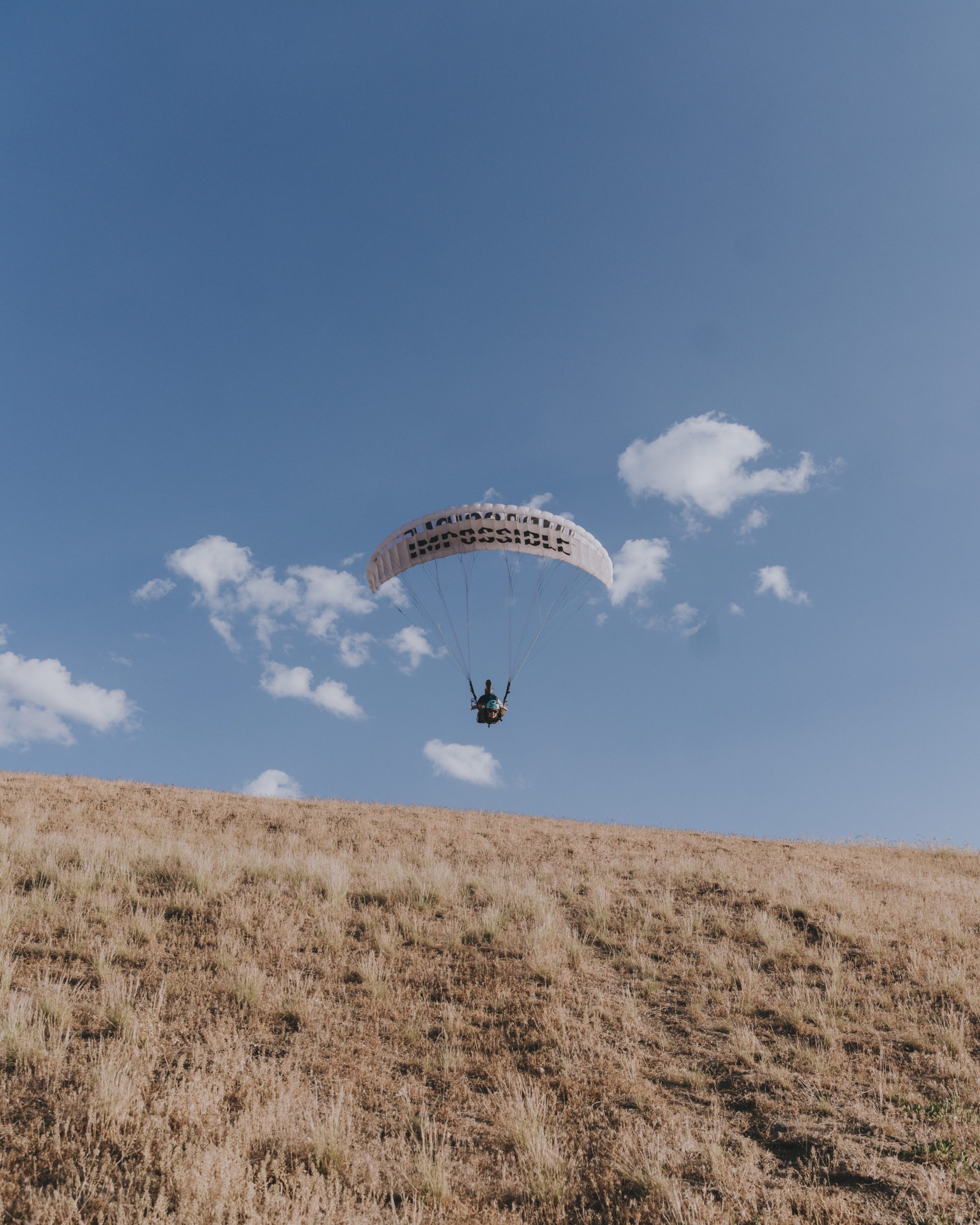 Paraglider just taken off from a hill